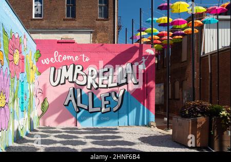 Umbrella Alley. A colorful artistic display of umbrellas hanging. Louisville, Ohio, USA. Stock Photo