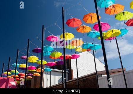 Umbrella Alley. A colorful artistic display of umbrellas hanging. Louisville, Ohio, USA. Stock Photo