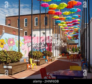 Umbrella Alley. A colorful artistic display of umbrellas hanging. Louisville, Ohio, USA. Stock Photo