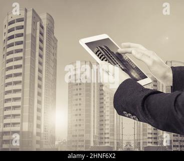 Businesswoman with smartphone on cityscape background Stock Photo
