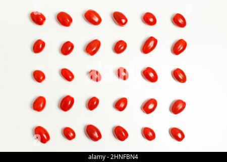 Tomatoes pattern on white background Cherry tomatoes, minimal concept Stock Photo