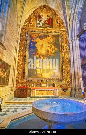 SEVILLE, SPAIN - SEPT 29, 2019: The Vision of St Anthony of Padova painting by Murillo and Baptismal Font in Capilla de San Antonio chapel of Seville Stock Photo
