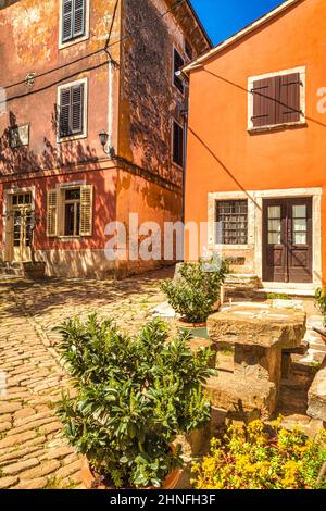 Ancient colorful houses on a stone street in Groznjan village, Istria, Croatia, Europe. Stock Photo