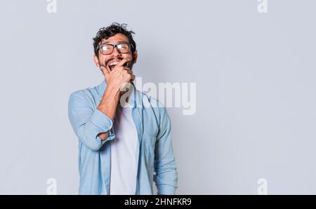 Man in glasses laughing with isolated background, attractive guy laughing discreetly and happy isolated Stock Photo