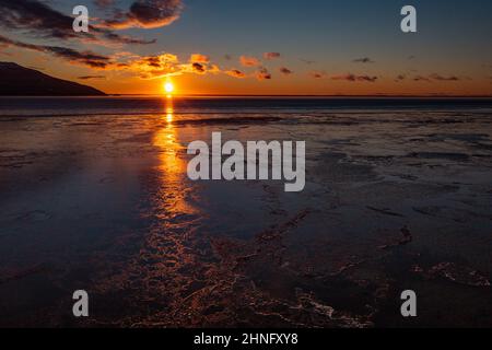 Sunset glows across Cook Inlet and the headwaters of Turnagain Arm near Anchorage, Alaska. Stock Photo