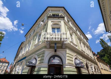 Picture of a Mercator Supermarket Sign on their Supermarket of Downtown Ljubljana during a sunny afternoon. Mercator is a Slovenian multinational reta Stock Photo