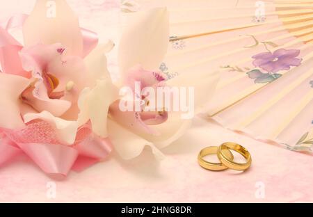 Wedding Bans and Orchids on Floral Backgorund Stock Photo