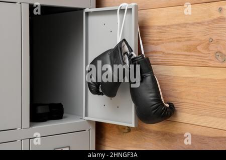 Locker with boxing gloves in change-room Stock Photo