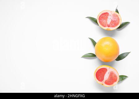 Delicious grapefruits on white background Stock Photo