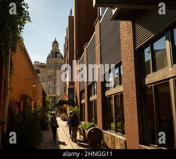 SAN ANTONIO, TX - 24 JAN 2020: Historic Hotel Emma, a modern luxury hotel created from an extremely old factory is seen beyond an alley by the Culinar Stock Photo