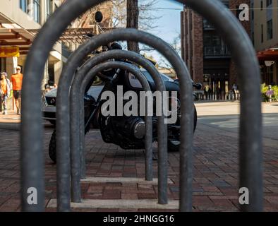 SAN ANTONIO, TX 24 JAN 2020: Metal bicycle rack and black Yamaha motorcycle on city street. Stock Photo