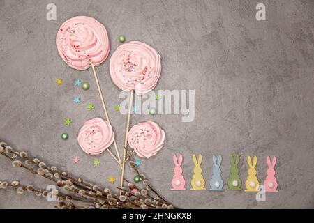 Whipped egg cream cookies . Easter composition with rabbits. Stock Photo