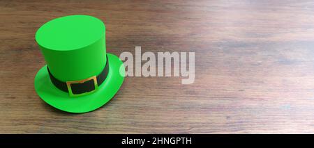 St Patricks Day leprechaun green hat isolated on wooden table background. Feast of Saint Patrick celebration, Irish traditional beer festival and part Stock Photo