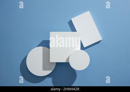 Top view of blue background with square and circle podium blank space for product advertising abstract content Stock Photo