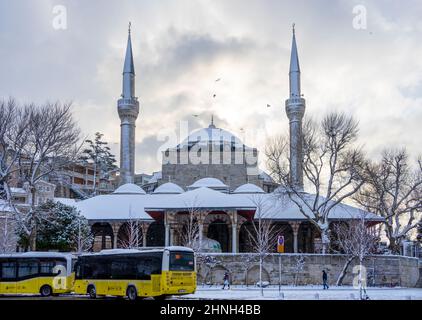 Front view of Mihrimah Sultan Mosque on winter day covered with snow in Istanbul, Turkey. Stock Photo