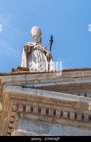 Piazza Pascoli square, Statue of the Cathedral of Santa Maria Assunta church, Urbino, Marche, Italy, Europe Stock Photo