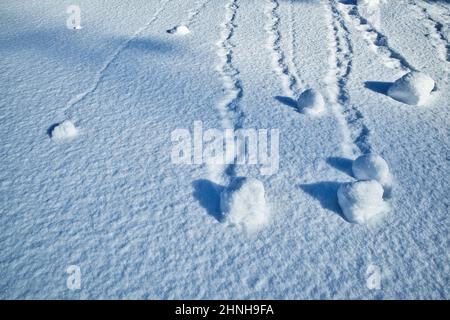 soft snow surface patterns in winter on hillside Stock Photo