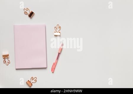 Top view desktop. Notepad pen paper clips on the table. Flat lay copy space Stock Photo
