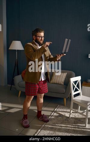 Freelance male worker video conferencing from home Stock Photo