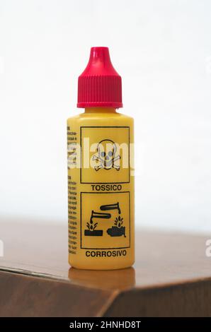 plastic bottle with toxic and corrosive labels Stock Photo