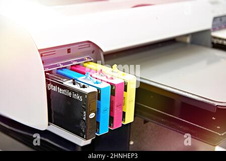 Ink color cartridges in printer for textile Stock Photo