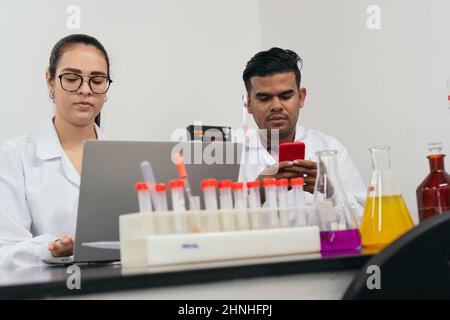 Chemists using a computer in a chemistry lab Stock Photo - Alamy