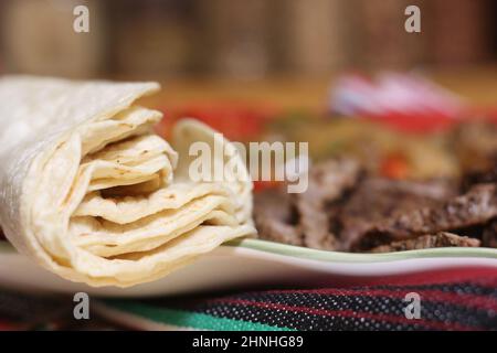 Fresh Corn Tortillas on Plate With Fajita Dinner Stock Photo