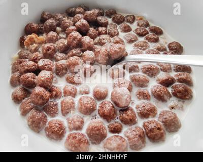 Healthy Breakfast of wheat balls and fresh milk on a light background. Side view. The concept of healthy, dietary breakfasts Stock Photo