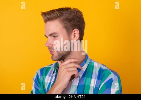 Deep thinker. Thinking man yellow background. Profile of pensive guy. Thinking is good Stock Photo