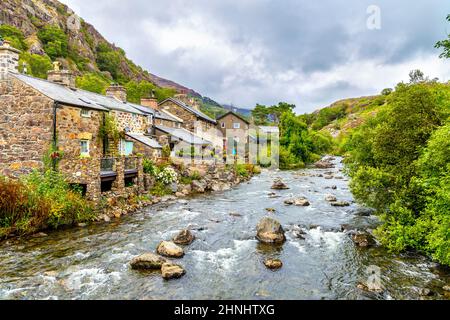 Charming stone cottages along River Colwyn at Beddgelert village in Gwynedd, Snowdonia National Park, Wales, UK Stock Photo