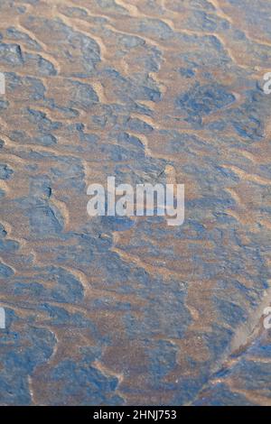 Wave Formed Ripple Marks with Sand on Stone on the Beach, Texture, Background, Normandy, France Stock Photo