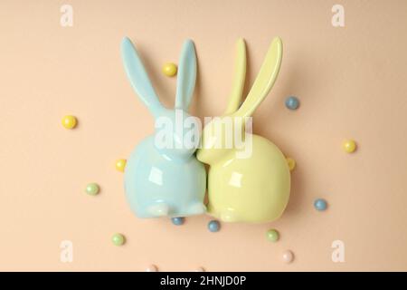 Easter bunnies on beige background, close up Stock Photo