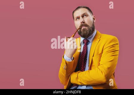 Thoughtful man smoking pipe Stock Photo