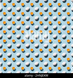 Organic white eggs and yolk with shadow on blue background. Abstract seamless pattern. Stock Photo