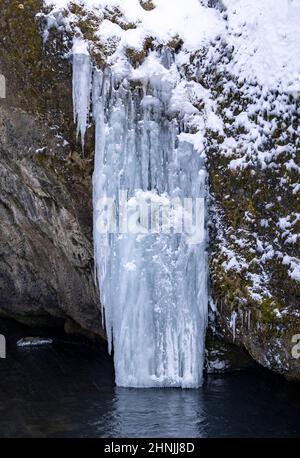 frozen waterfall at Kvernufoss, Vatnajokull National Park, south east Iceland Stock Photo