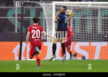 Milano, Italy. 16th Feb, 2022. Stefan de Vrij (6) of Inter and Diogo Jota (20) of Liverpool seen during the UEFA Champions League match between Inter and Liverpool at Giuseppe Meazza in Milano. (Photo Credit: Gonzales Photo/Alamy Live News Stock Photo