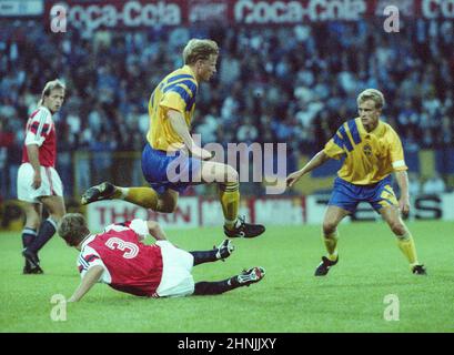 ROGER LJUNG Admira Wacker and Jonas Thern Napoli jump over Tore Pedersen at a friendly game against Norway at Ullevål Stadium in Oslo 2-2 Stock Photo