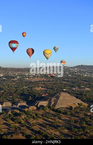 Mexico, Mexico City, Aerial view of the Teotihuacán archaeological zone with hot air balloons at sunrise over the Pyramids