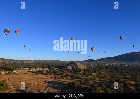 Mexico, Mexico City, Aerial view of the Teotihuacán archaeological zone with hot air balloons at sunrise over the Pyramids