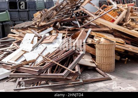 Recycling dump with trash of broken window and door frames, furniture and more Stock Photo