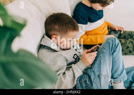 Children with Mobile Phone Outdoor. Two Boys Smiling, Looking To Screen,  Playing Games or Using Application. Technology Stock Image - Image of  entertainment, application: 74960749