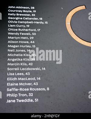 Manchester, UK, 17th February, 2022.  A list of those killed, at the Glade of Light memorial: a white marble ‘halo’ bearing the names of those killed in the 22nd May 2017 bombing. The Manchester Arena Inquiry has heard that MI5 had intelligence to assess Salman Abedi as a threat to national security and open an investigation before he carried out the bombing on 22nd May 2017, killing 22 people and injuring hundreds. Credit: Terry Waller/Alamy Live News Stock Photo
