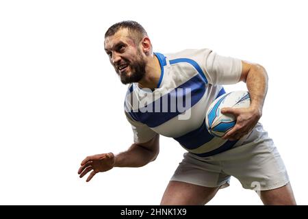 Defensive play. One male rugby players playing rugby football isolated on white background. Sport, activity, health, hobby, occupations concept Stock Photo