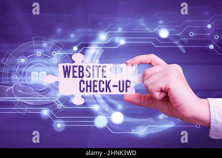 Conceptual caption Website Check Up, Word Written on an examination of a website to see if something is in order Hand Holding Jigsaw Puzzle Piece Unlo Stock Photo