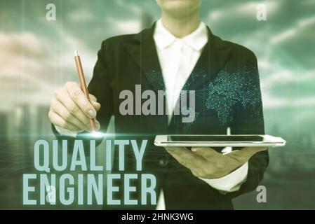 Handwriting text Quality Engineer, Business idea ensure the overall quality of a manufactured product Lady In Uniform Standing Holding Tablet Typing F Stock Photo