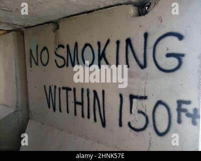 No Smoking spray painted on cement bunker wall in Afghanistan Stock Photo