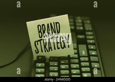 Text sign showing Brand Strategy, Business concept Long term marketing support for a product Marketing Writing Complaint On Social Media, Reporting Ba Stock Photo