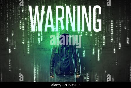 Faceless hacker with inscription Stock Photo