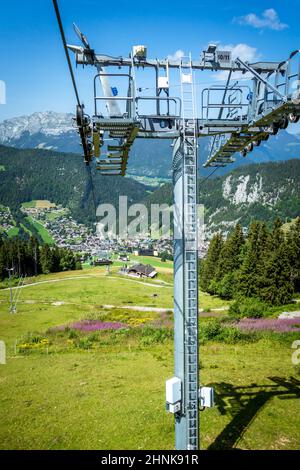 Chair lift above the village of La Clusaz, France Stock Photo