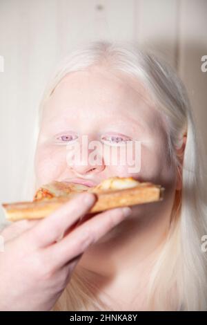 Woman Eating Pizza Stock Photo
